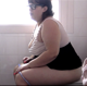 A fat girl wearing glasses takes a piss and a shit while sitting on a toilet. Audible plop is heard. She wipes her ass, shows us her dirty toilet paper and messy product in great detail in the toilet bowl. Presented in 720P HD. Over 5 minutes.
